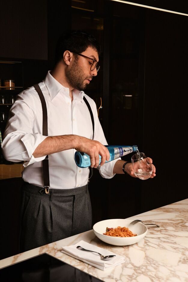 man-pouring-pasta
